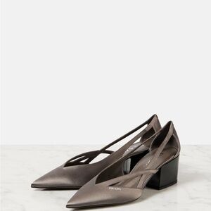 New in box Pointy 55 cutout pumps in grey. Size 39